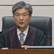 Judge Kim Se-yoon reads the verdict during the trial of impeached former president Park Geun-hye at the Seoul Central District Court.